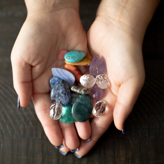 Hand full heart of gemstones