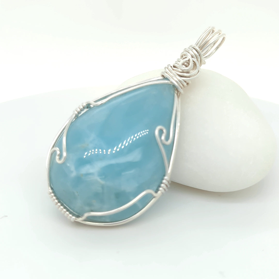 Aquamarine pendant in sterling silver wire wrapped setting