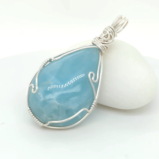 Aquamarine pendant in sterling silver wire wrapped setting